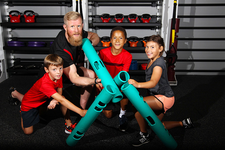 Children and ViPR trainer holding new 2KG ViPR